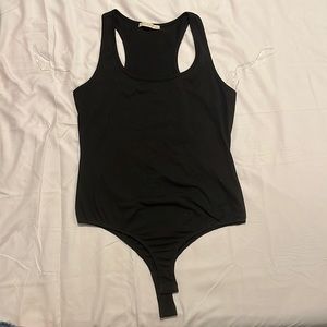 Size M body suit RUNS SMALL